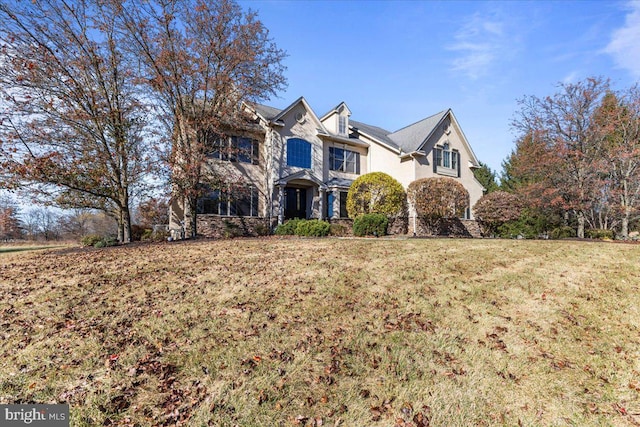 view of property featuring a front yard