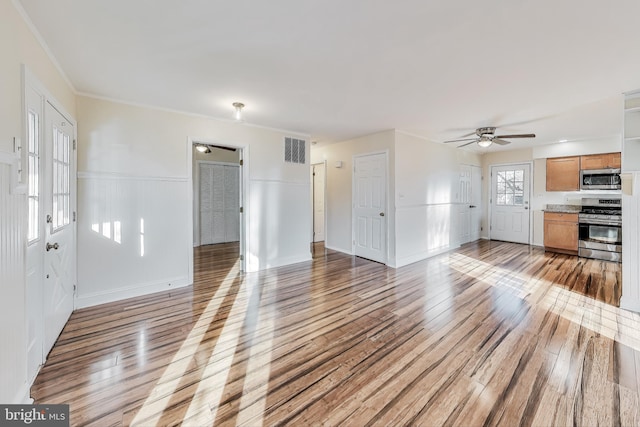 unfurnished living room with light hardwood / wood-style flooring, ceiling fan, and crown molding