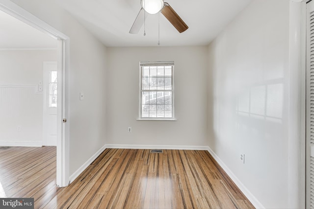 spare room with ceiling fan and light hardwood / wood-style flooring