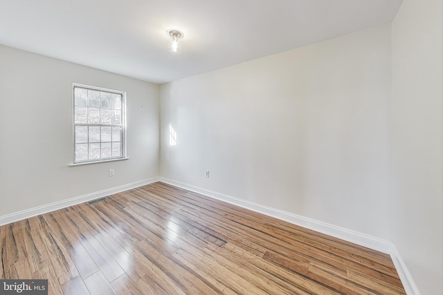 spare room with light wood-type flooring