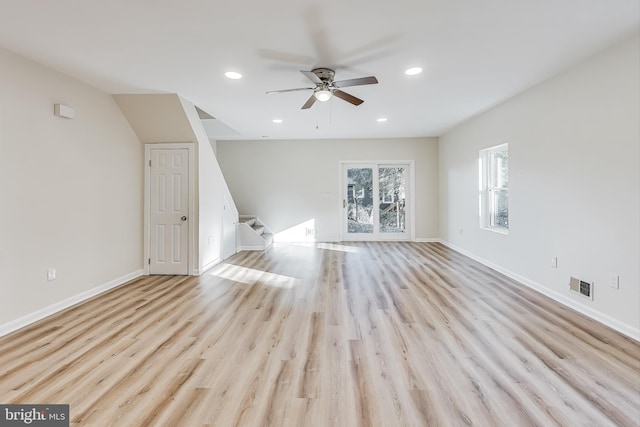 unfurnished living room with ceiling fan and light hardwood / wood-style floors