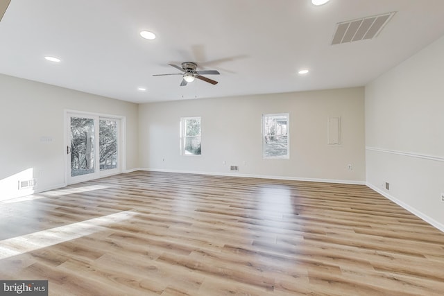 unfurnished room featuring ceiling fan and light hardwood / wood-style flooring