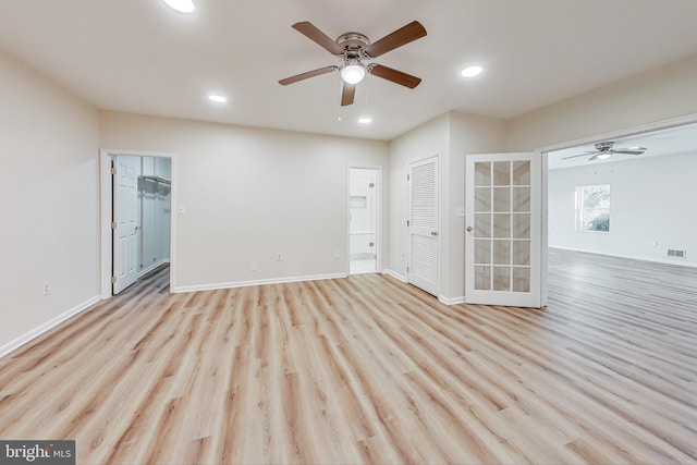 spare room with ceiling fan and light hardwood / wood-style floors