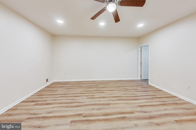 spare room featuring ceiling fan and light wood-type flooring