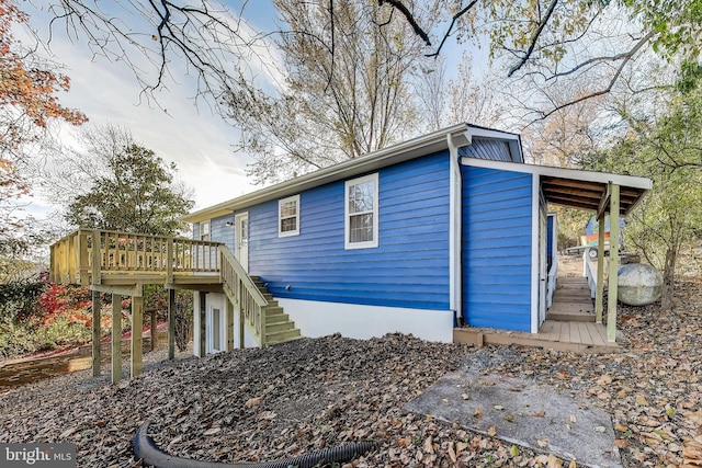 view of property exterior featuring a deck