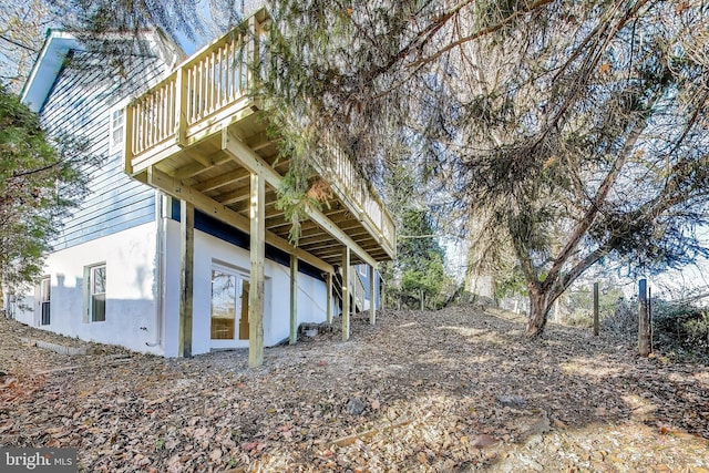 view of side of property featuring a deck