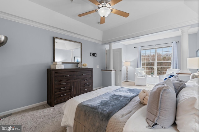 carpeted bedroom with decorative columns and ceiling fan