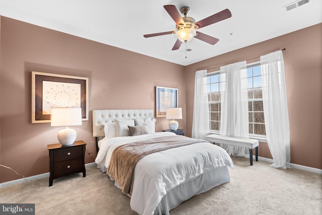 bedroom featuring light carpet and ceiling fan