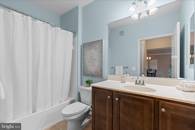 full bathroom featuring vanity, shower / tub combo with curtain, tile patterned floors, and toilet