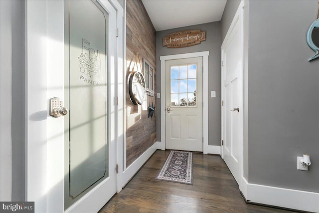 doorway to outside featuring dark hardwood / wood-style flooring