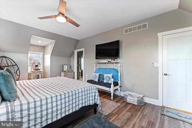 bedroom with wood-type flooring, ceiling fan, and lofted ceiling