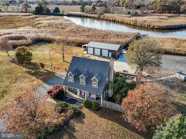 birds eye view of property featuring a rural view and a water view