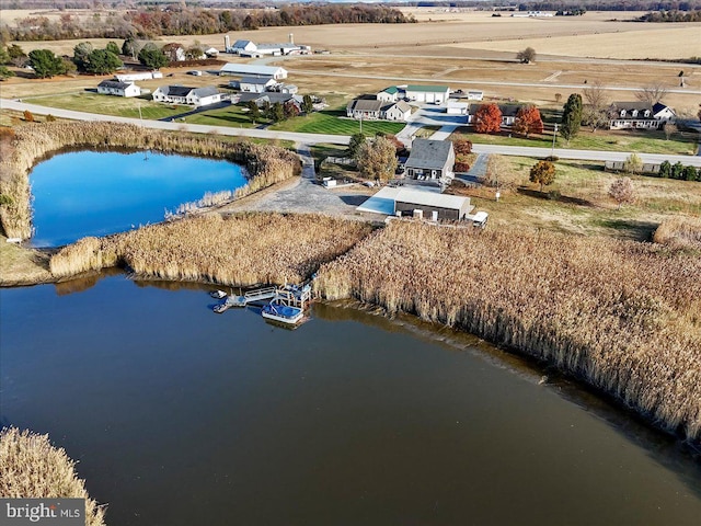 birds eye view of property with a rural view and a water view