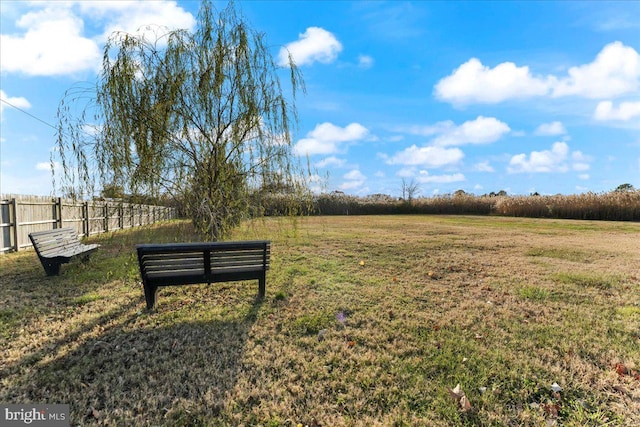 view of home's community with a lawn