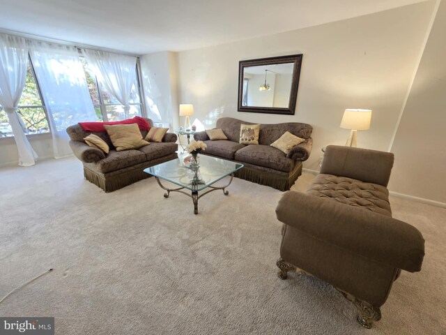 living room featuring light carpet