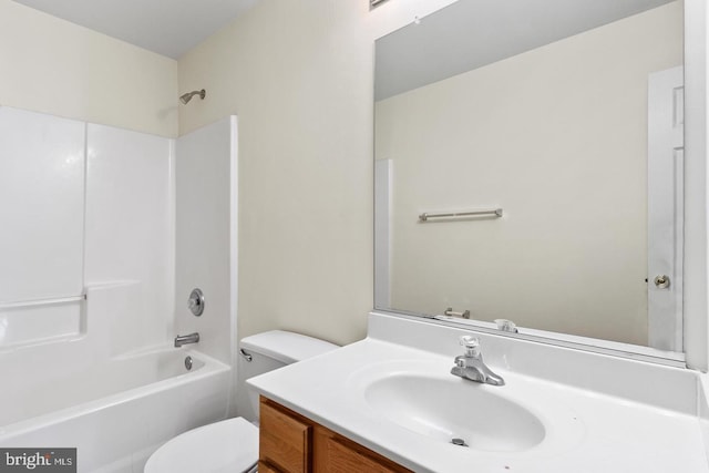 full bathroom with shower / bathing tub combination, vanity, and toilet