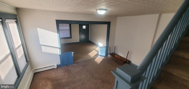 stairs with carpet flooring and a textured ceiling