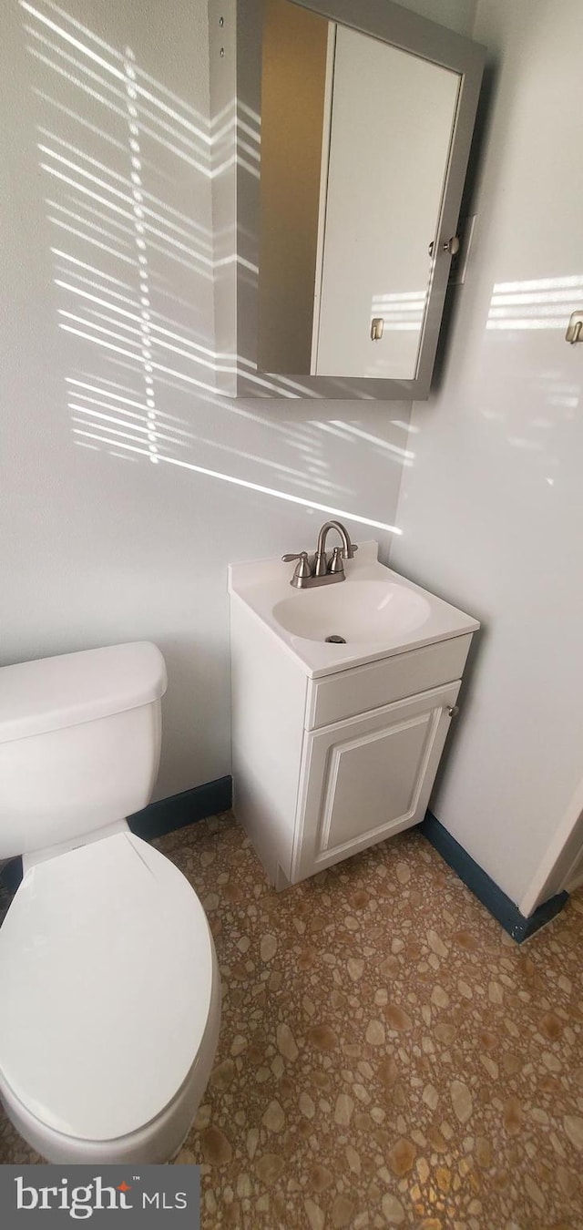 bathroom with vanity and toilet