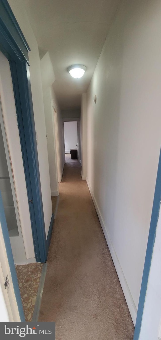 hallway with dark carpet