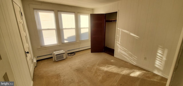 unfurnished bedroom with multiple windows, a closet, and light colored carpet