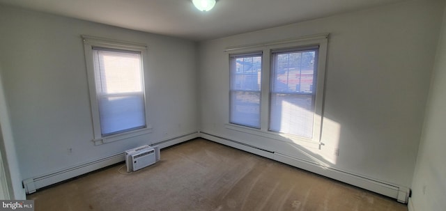 unfurnished room with a baseboard radiator