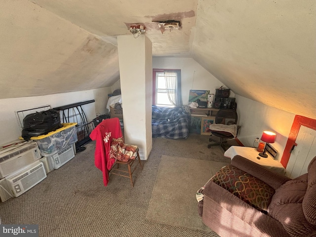 bonus room with carpet flooring, a textured ceiling, and lofted ceiling