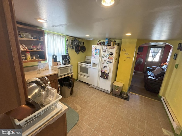 kitchen featuring white appliances and a baseboard radiator