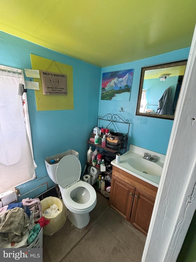 bathroom with vanity, toilet, and plenty of natural light