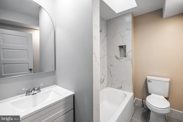 full bathroom with tile patterned flooring, vanity, toilet, and tiled shower / bath