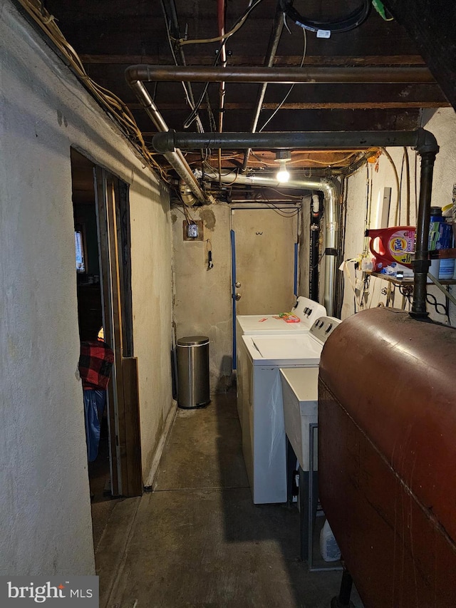 basement with washer and clothes dryer