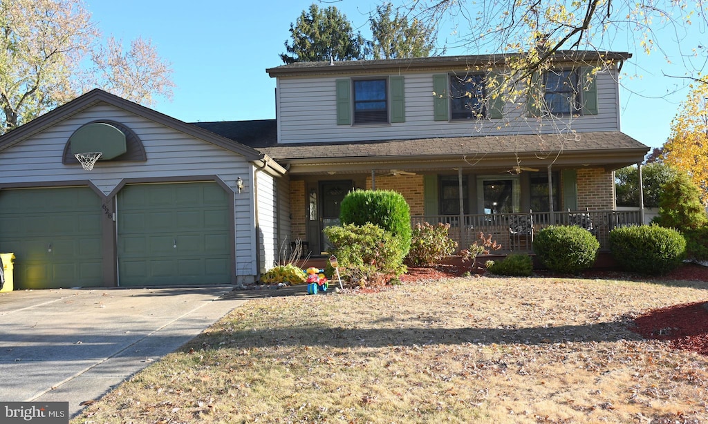 view of front property featuring covered porch and a garage