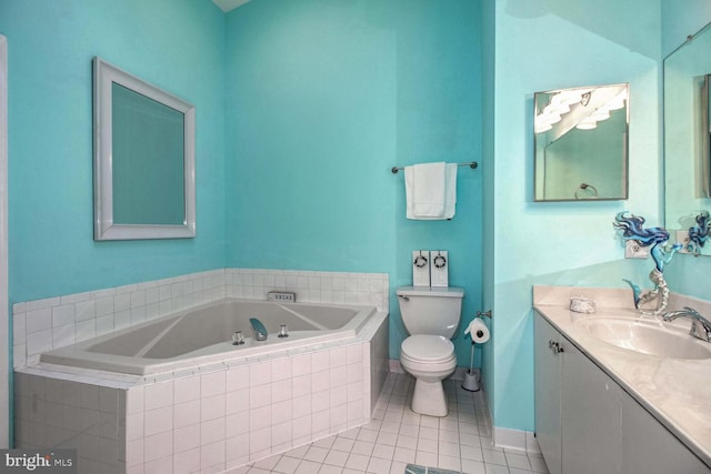 bathroom featuring tile patterned flooring, vanity, toilet, and tiled tub