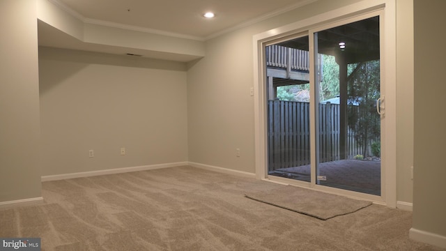 carpeted empty room featuring ornamental molding