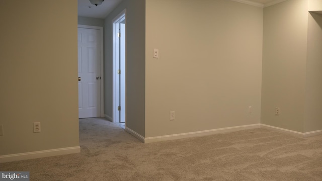 unfurnished room with light colored carpet