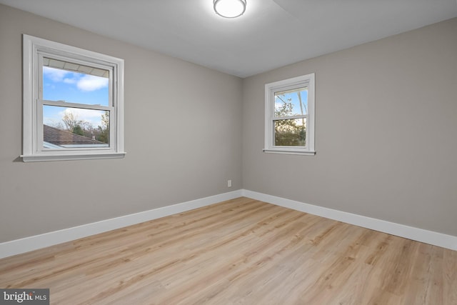 spare room featuring light hardwood / wood-style flooring