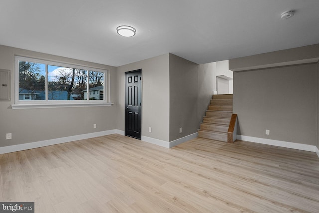 interior space featuring light wood-type flooring and electric panel