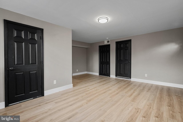 unfurnished room featuring light wood-type flooring