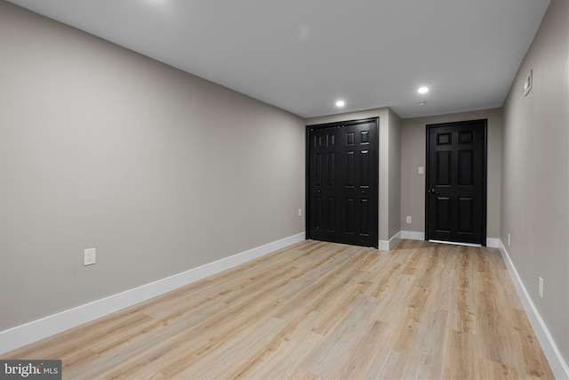 foyer entrance with light hardwood / wood-style flooring