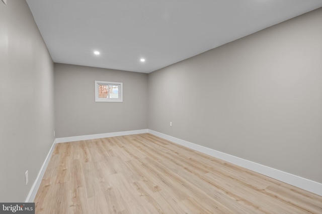 unfurnished room with light wood-type flooring