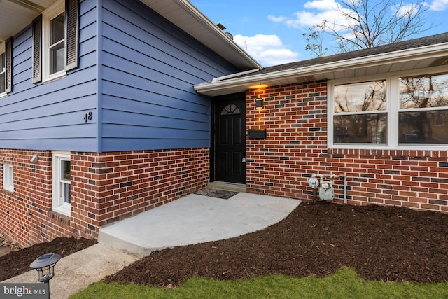 doorway to property with a patio