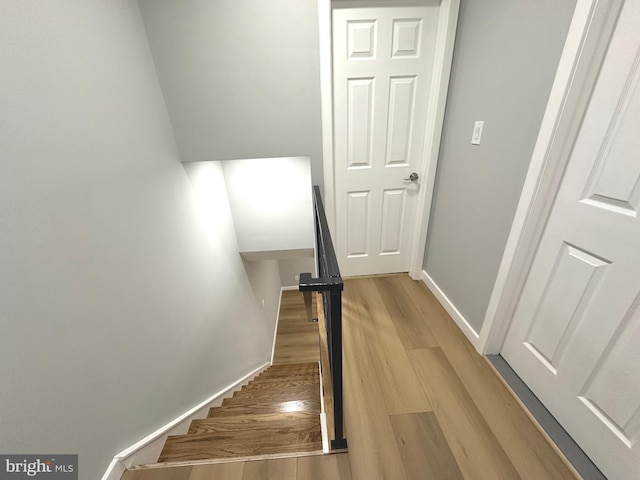 staircase featuring hardwood / wood-style flooring