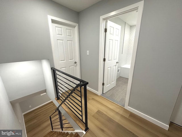 staircase featuring hardwood / wood-style floors