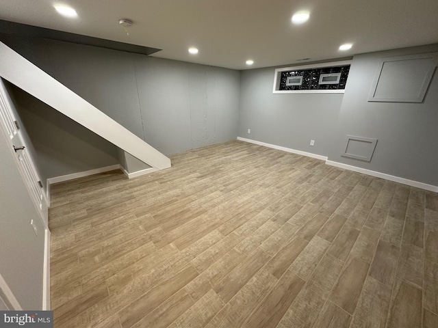 basement featuring light hardwood / wood-style flooring