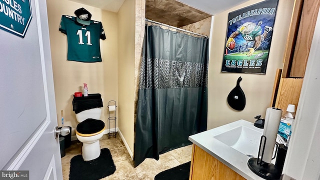 bathroom with vanity, toilet, and walk in shower