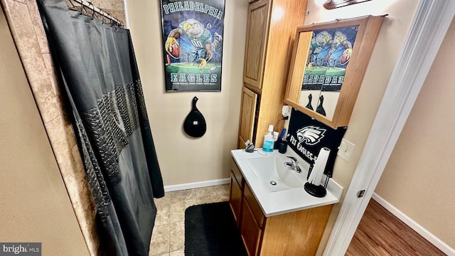 bathroom featuring hardwood / wood-style floors and vanity