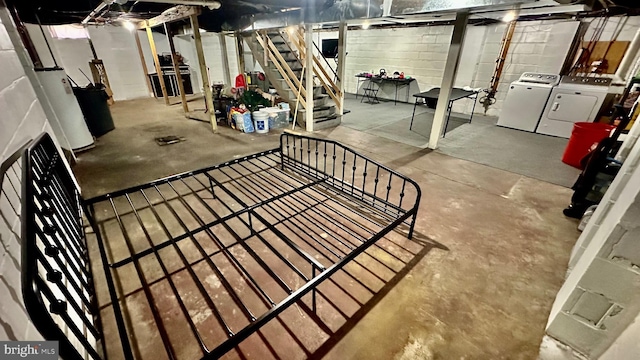 basement with washing machine and dryer and water heater