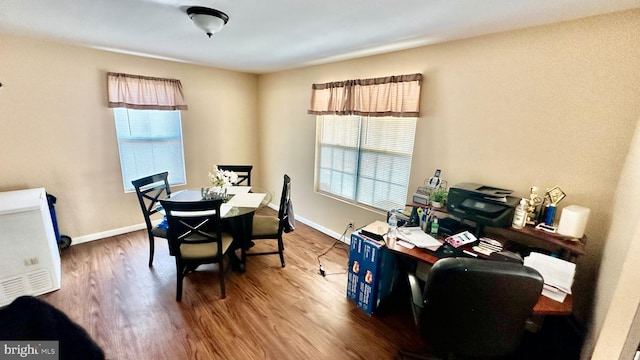 dining area featuring hardwood / wood-style flooring and plenty of natural light