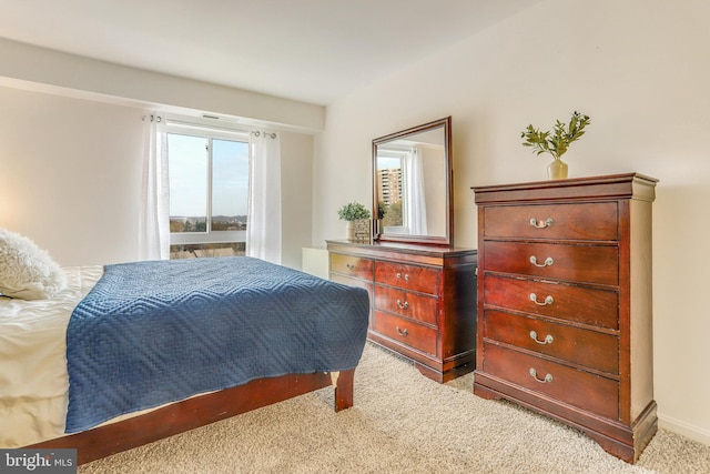 bedroom featuring light colored carpet