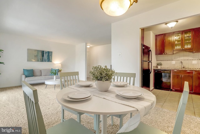 tiled dining area featuring sink