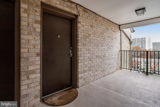 doorway to property featuring a balcony